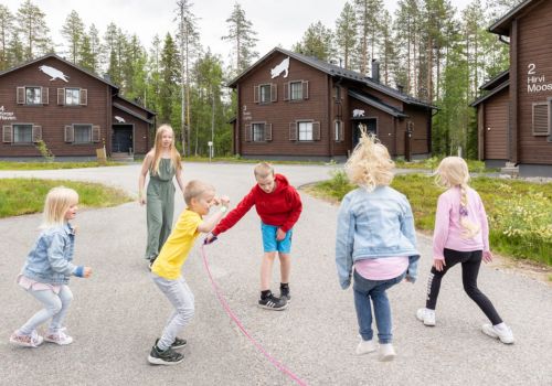 Children playing in front of the Holiday Villas