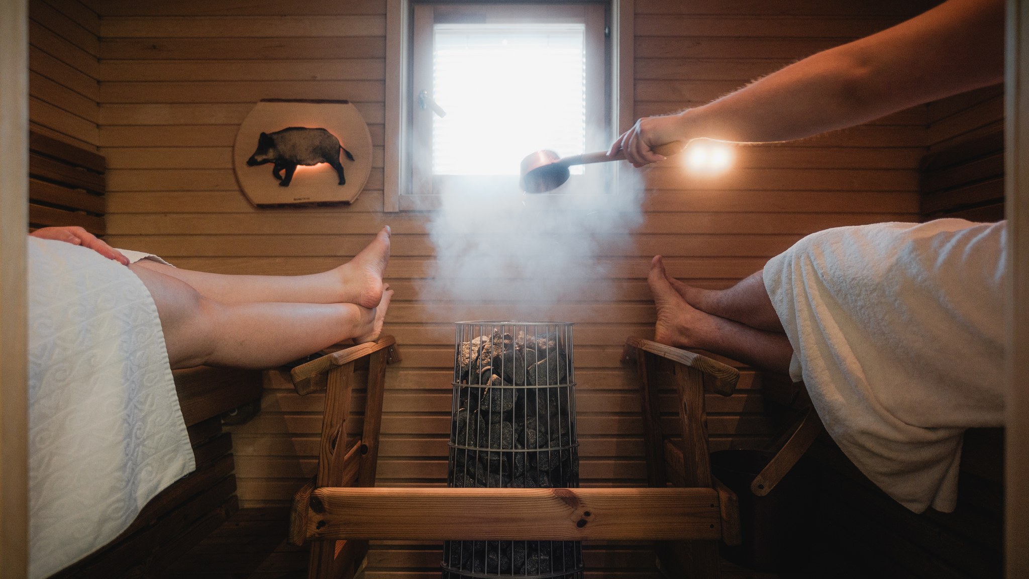 two persons in holiday villa sauna
